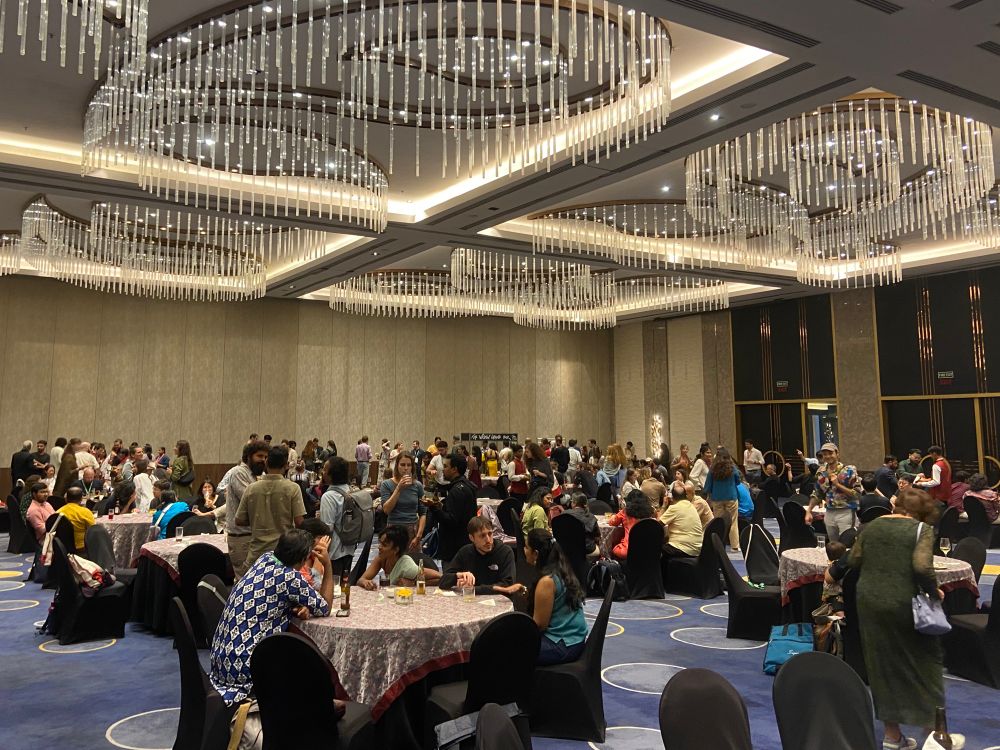 Tables in a ballroom with folks seated