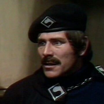 One of Trenchard's guards with a thick brown slug of a moustache 