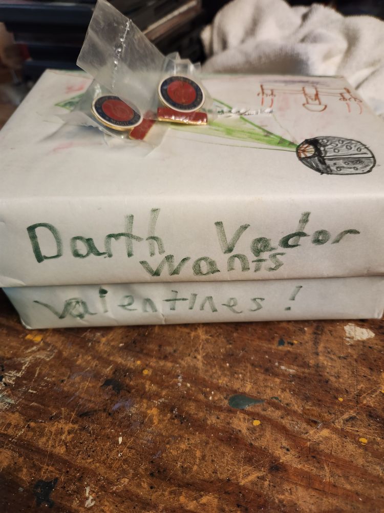 A box for valentines, decorated in Star Wars style, reading "Darth Vader wants valentines!" on the side.