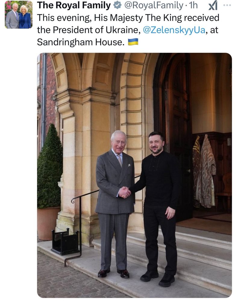 Picture from the UK Royal Family’s official social media channel with Charles in a suit and Zelenskyy in his usual black outfit. Shaking hands at the wide open front door to a palace. Caption: “this evening, His Majesty The King received the President of Ukraine at Sandringham House”.