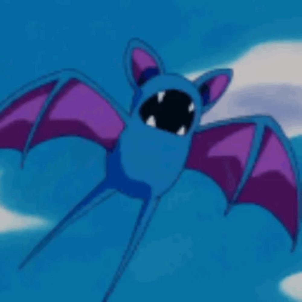 a blue bat with purple wings is flying in the sky with its mouth open .