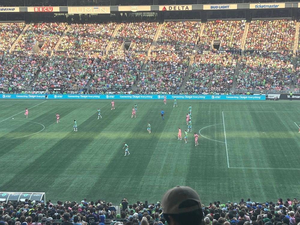 Seattle Sounders VS Miami FC at Lumen Field. Photo of live action with Seattle in their home green kits & Miami in their pink kits.