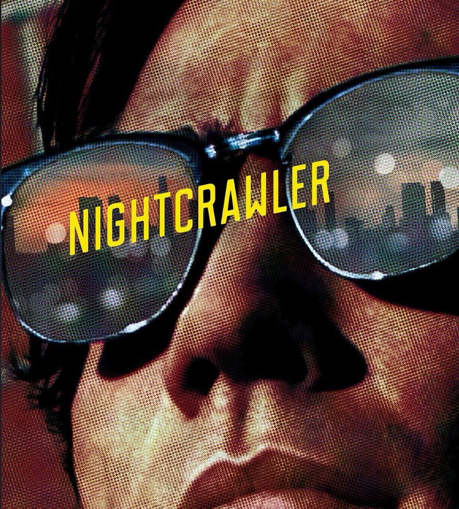 Nightcrawler Movie Poster. A man is wearing sunglasses with LA reflected in them.