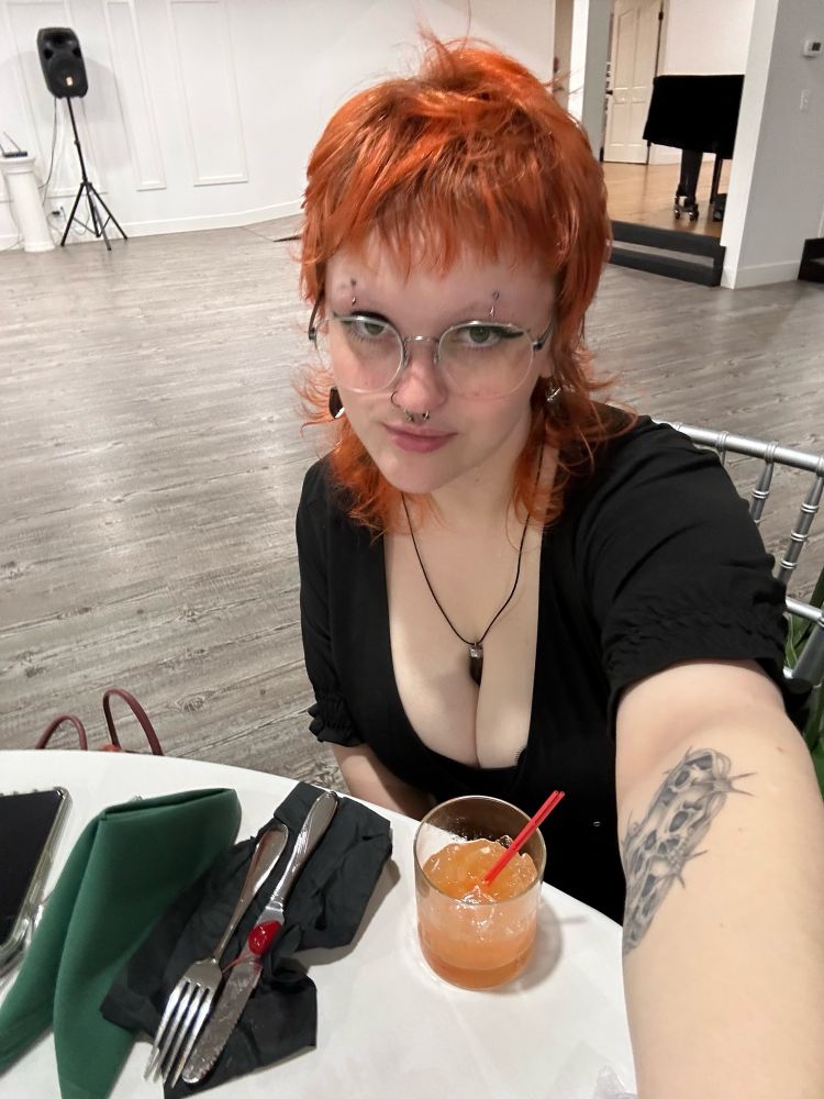 Me again at a wedding looking good as fuck despite my hair giving helmet