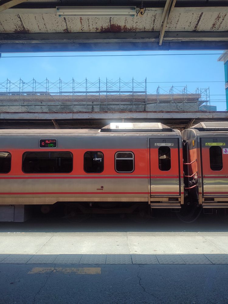 An orange train at Tainan station. 