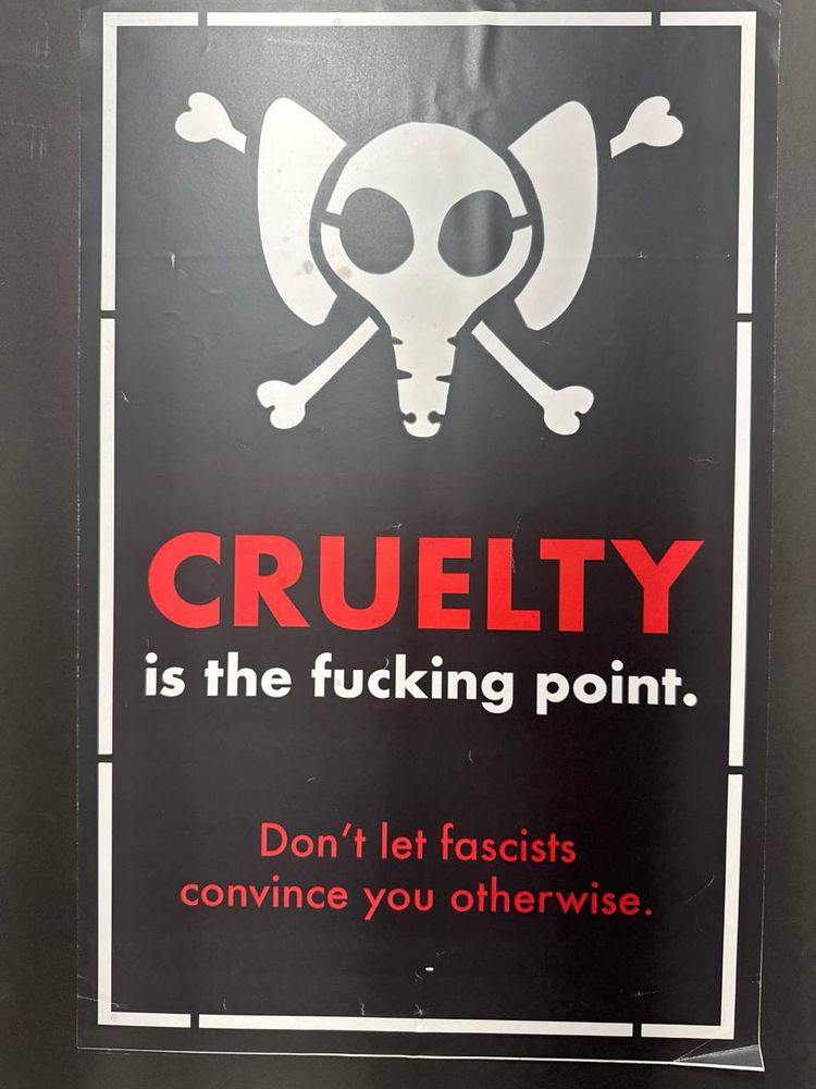 An elephant skull and crossbones over the words “CRUELTY is the fucking point.
Don't let fascists convince you otherwise.”