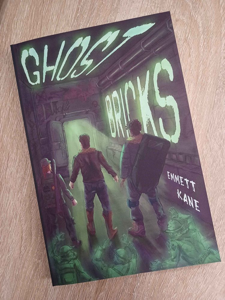 A photograph of the novel Ghost Bricks on a desk