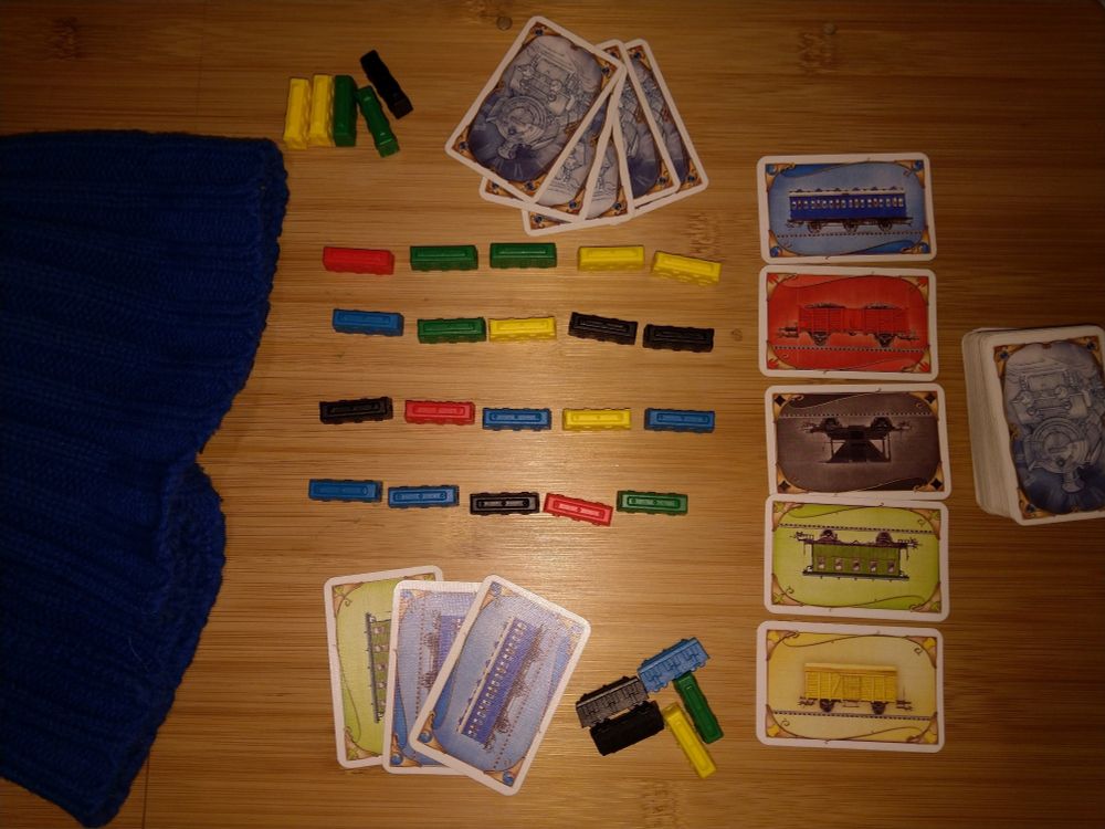 Ticket to ride components without a board laid out to follow the rules of the "station yard" varient rules.