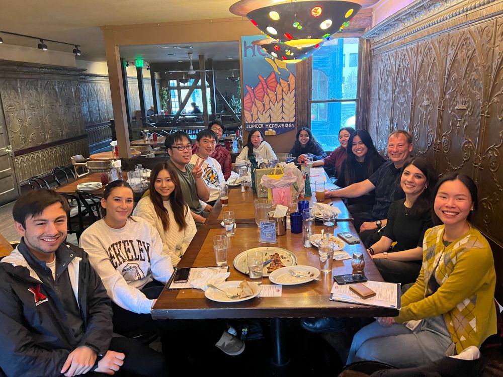 The Andreas Stahl lab members gathered around a table. 