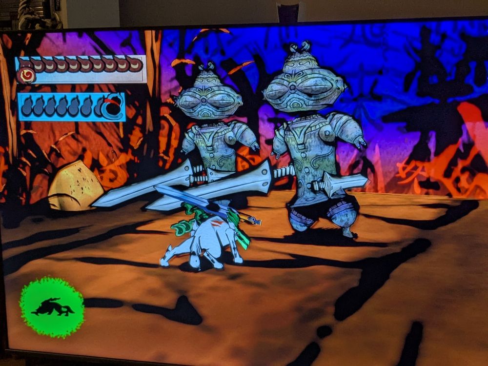 A screenshot from the game Okami, showing Amaterasu facing off against monsters that look like Japanese dogū statues. the same statues were used as inspiration for the Arahabaki shadows in Persona 5, which notoriously repel physical attacks 