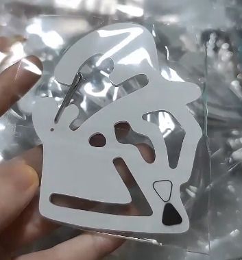 a carabiner in the shape of ingo and emmet's profile shot.