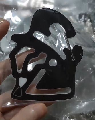 a carabiner in the shape of ingo and emmet's profile shot.