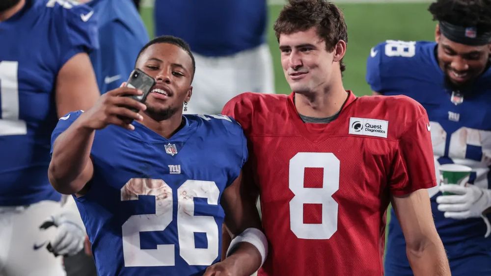 Saquon Barkley and Daniel Jones taking a selfie during their time with the New York Giants 