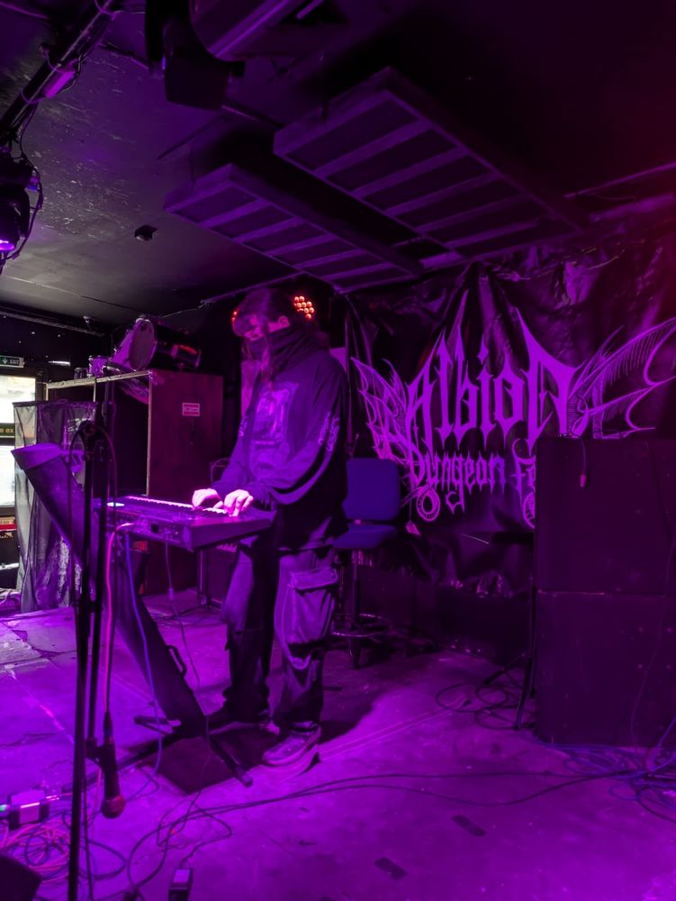 Someone playing synthesiser on stage