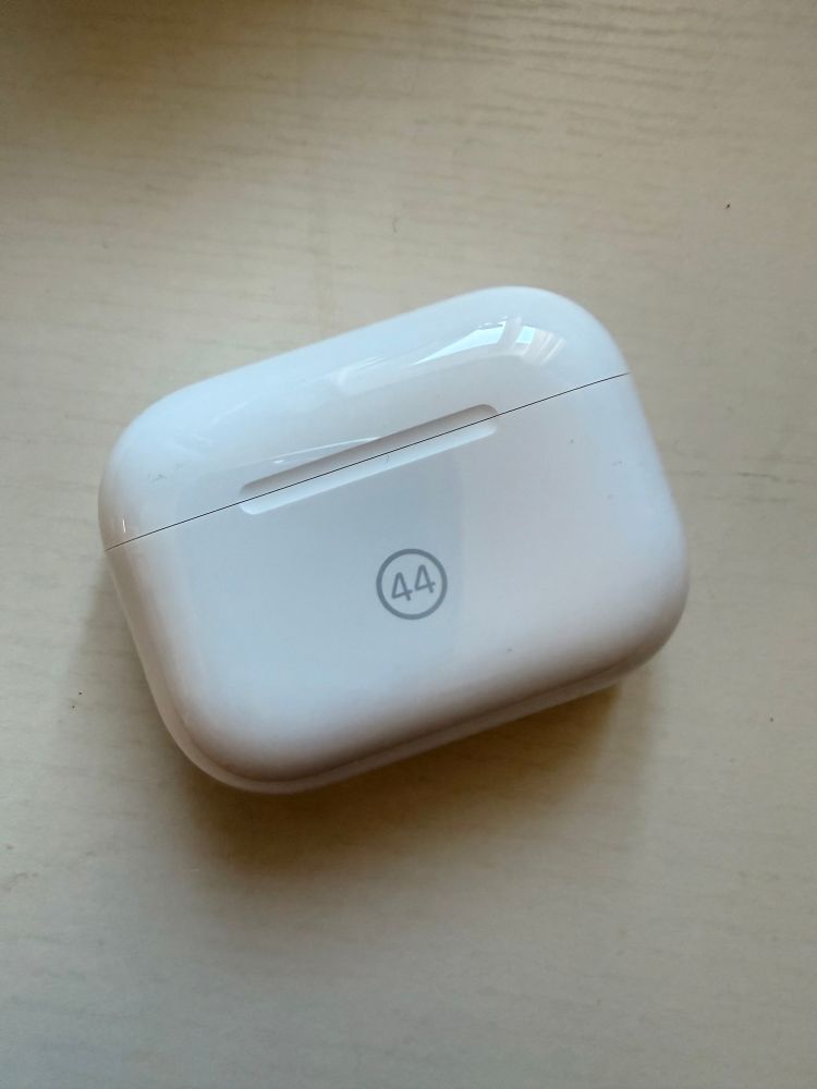 AirPod case with 44 on it 