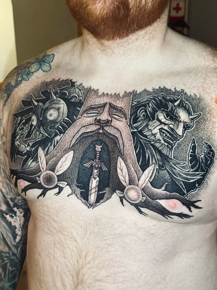 A chest tattoo showing the great deku tree, fairies, majora and ganondorf