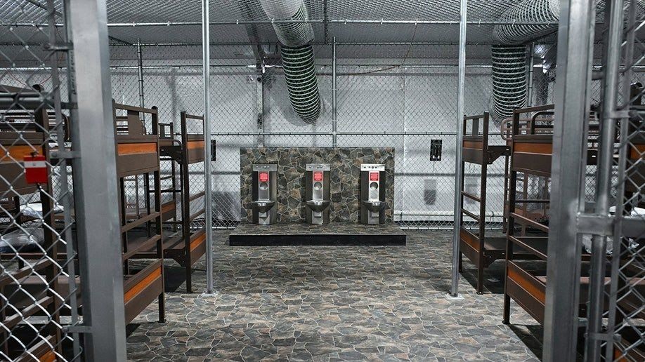 Joint sleeping and washing quarters in massive cages for undocumented people