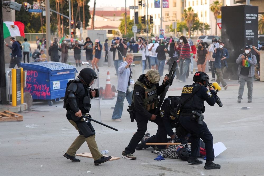 Ice and police beat protester