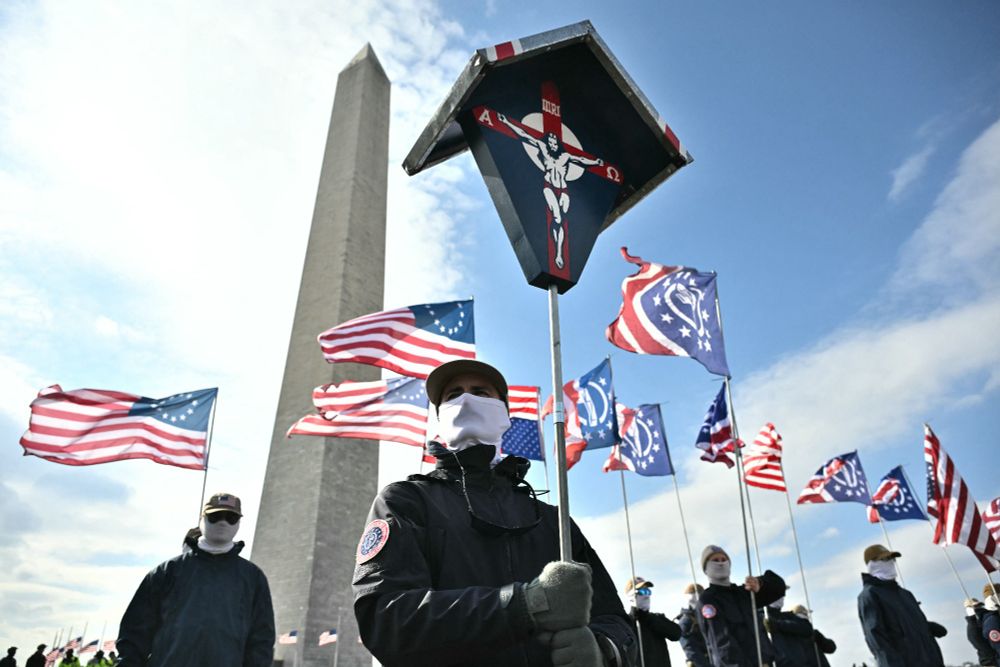 Members of white supremacist group Patriot Front rally near the Washington Monument during the march. Photo: Andrew Caballero-Reynolds via Getty Images