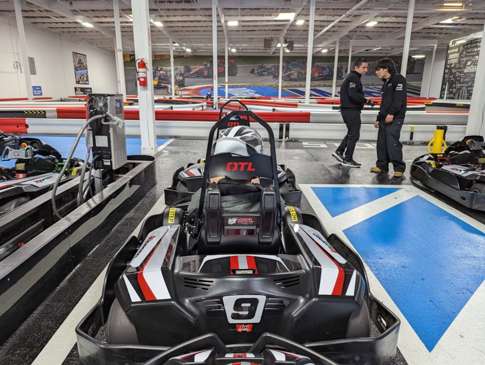 Photo of a go-kart track from the point of view of a driver. We are waiting for the race to get started.