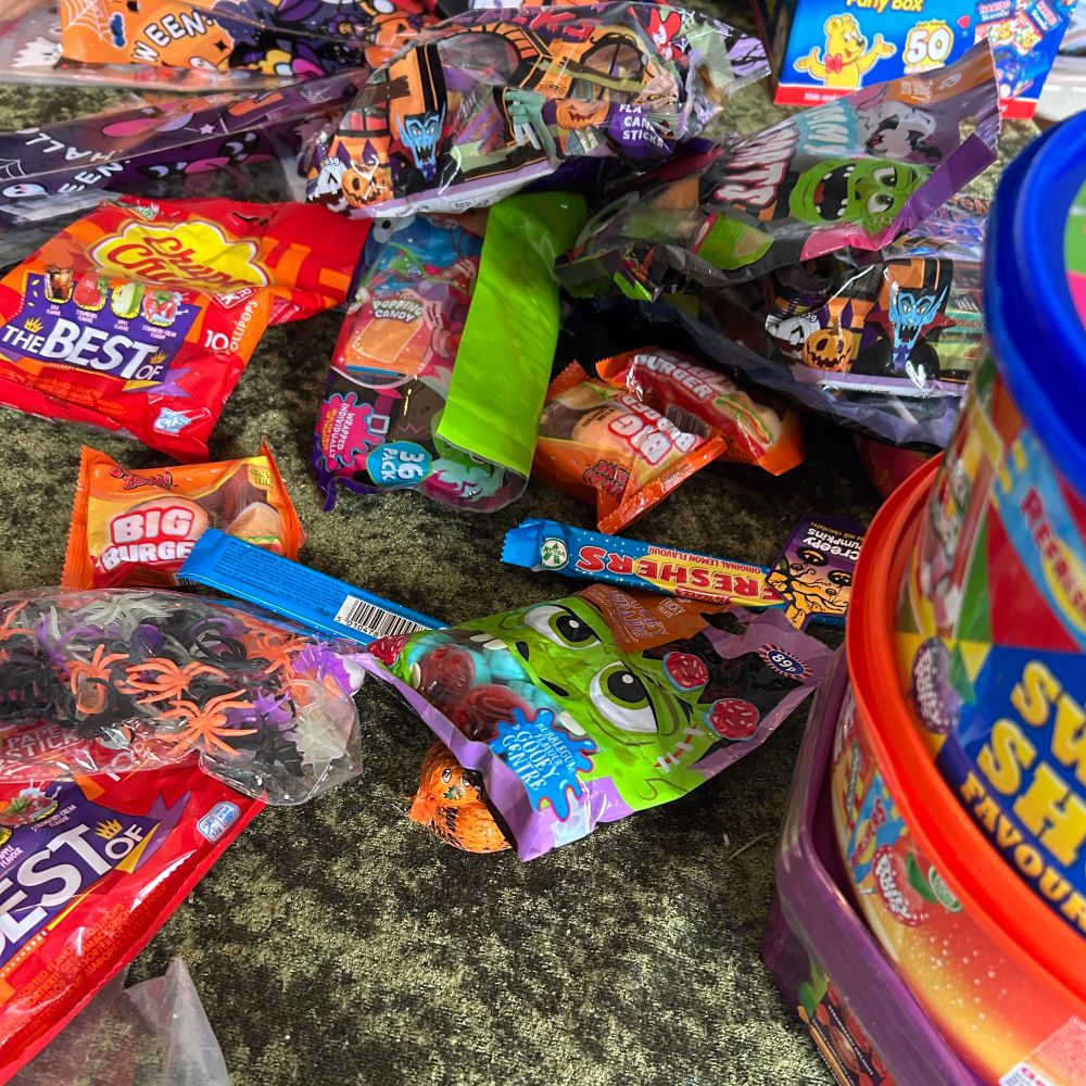 A massive pile of sweets ready to get bagged for Halloween visitors