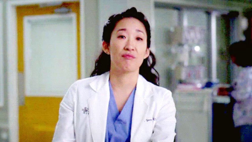 a female doctor wearing a lab coat with the name sandra written on it