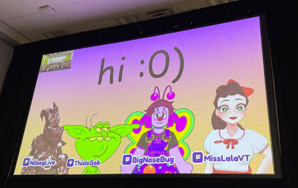 the projector screen from the toon vtuber panel with nilbog, gob, bug, and miss lala