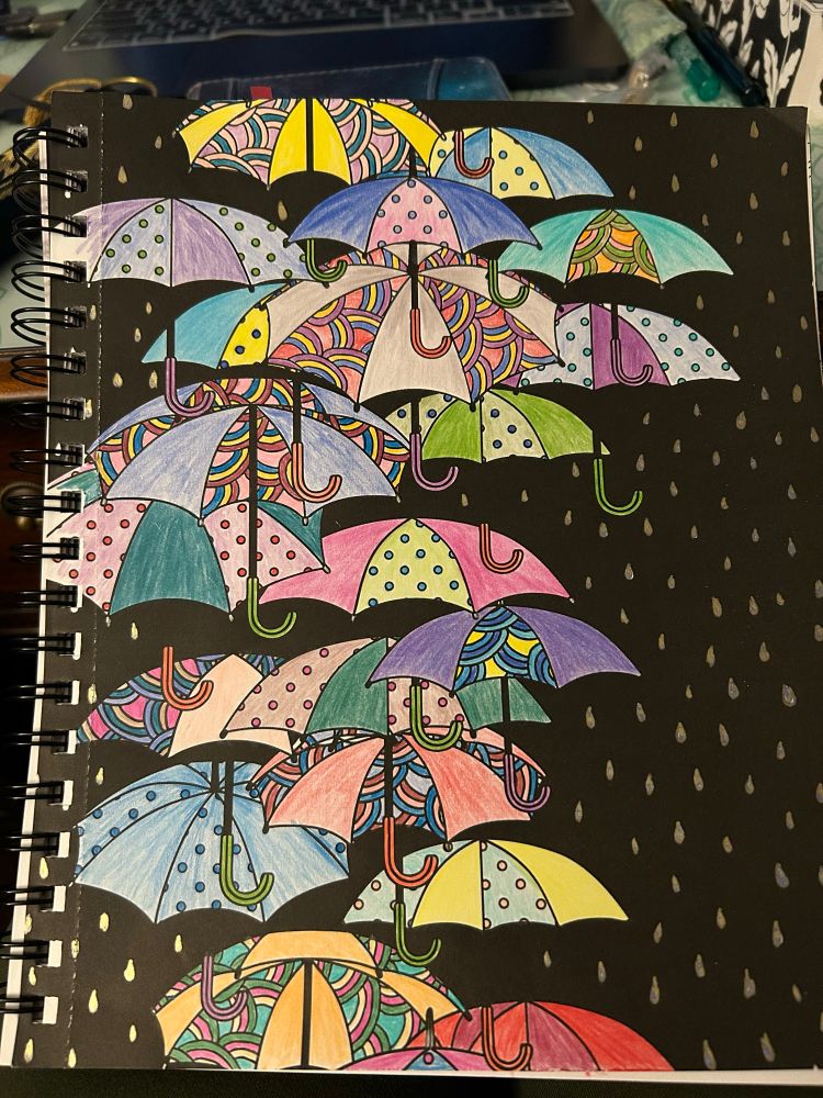 Colouring book page of umbrellas floating in the rain coloured in a bright and chaotic way 