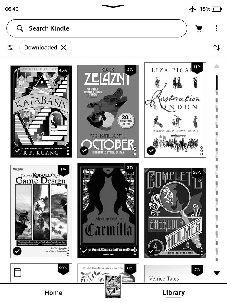 Screenshot of a Kindle Paperwhite, black and white / greyscale colour, showing two rows of three books. On the top are “Katabasis” by R.F. Kuang, “A Night in the Lonesome October” by Roger Zelazny, and “Restoration London: Everyday Life in London 1660-1670” by Liza Picard. On the row below are “The Complete Kobold Guide to Game Design”, “Carmilla” by Sheridan Le Fanu, and a “Complete Sherlock Holmes” collection.