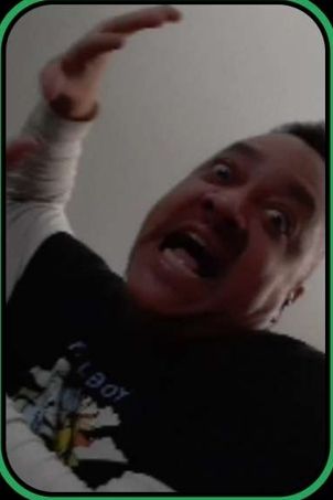 A picture of myself, a Black man during a particularly heated exchange. My eyes are wild and crazy and my hand is raised as if to deliver some terrifying slap. I'm enjoying myself. 