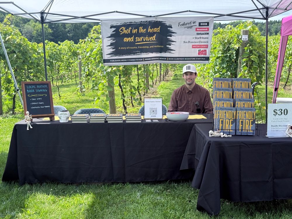 My book fair display in the middle
Of a vineyard. Me smiling like a 90 degree dork 