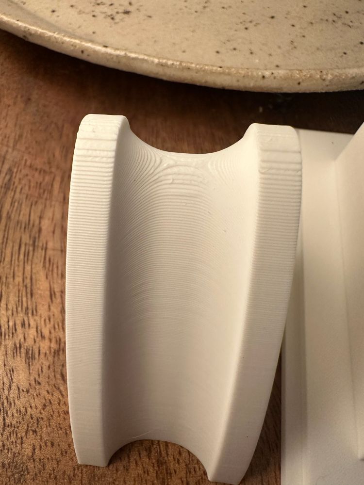 photo of a 3d print with aggressive curves and very visible layer lines from a 0.4mm hotend