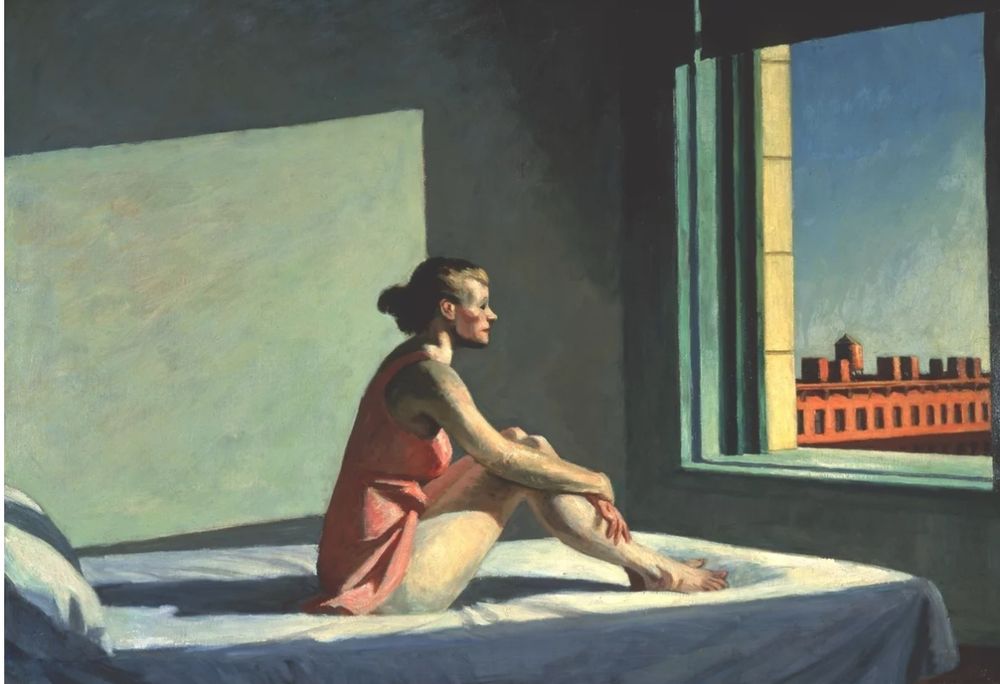 Edward Hopper’s “Morning Sun” (1952) - a woman in a pink dress sits on a bed facing an open window.