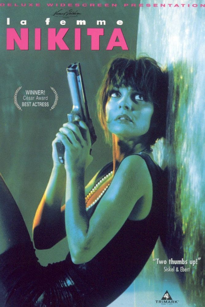 Movie poster for the 1991 French film “La Femme Nikita” showing the start sitting on the ground leaning against a wall with a gun in her hands.