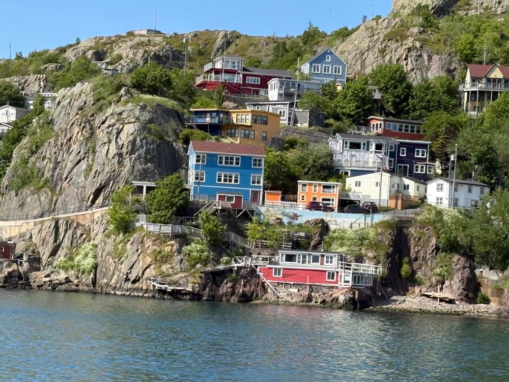 Houses built into the cliff in St. John’s Harbour