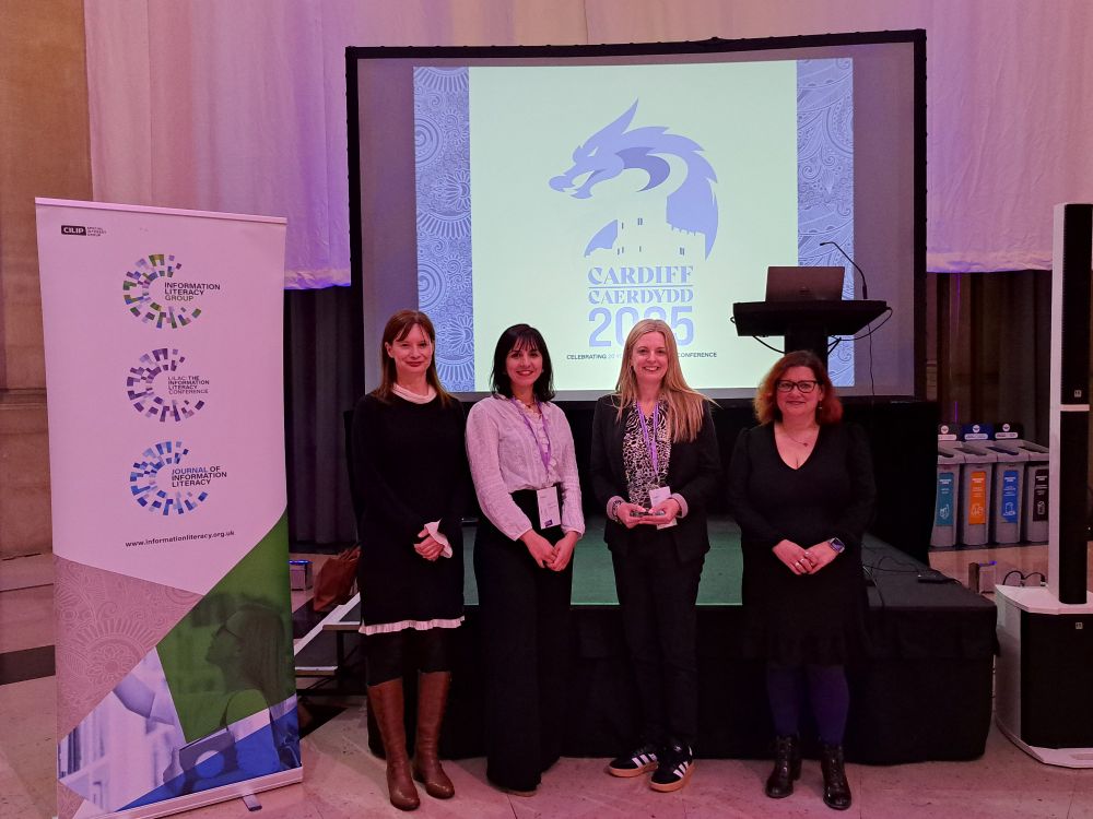 Photograph of the CILIP Information Literacy Group Information Literacy Award 2025 winner, Rebecca Mogg. Rebecca is with the award judges, Elizabeth Newall, Konstantina Martzoukou and Eva Garcia Grau (left to right - Elizabeth,  Konstantina, Rebecca and Eva). The award is being given out in the National Museum Cardiff at the LILAC 2025 networking evening. 