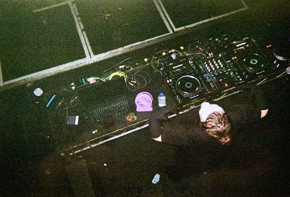 Luxury Elite on the decks at FlamingoFest 2023, shot from above by an analogue camera.