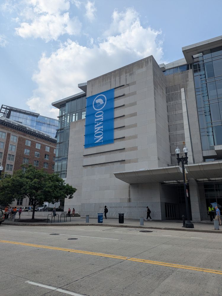 A giant banner for Otakon hangs on the side of the Walter Washington convention center in DC