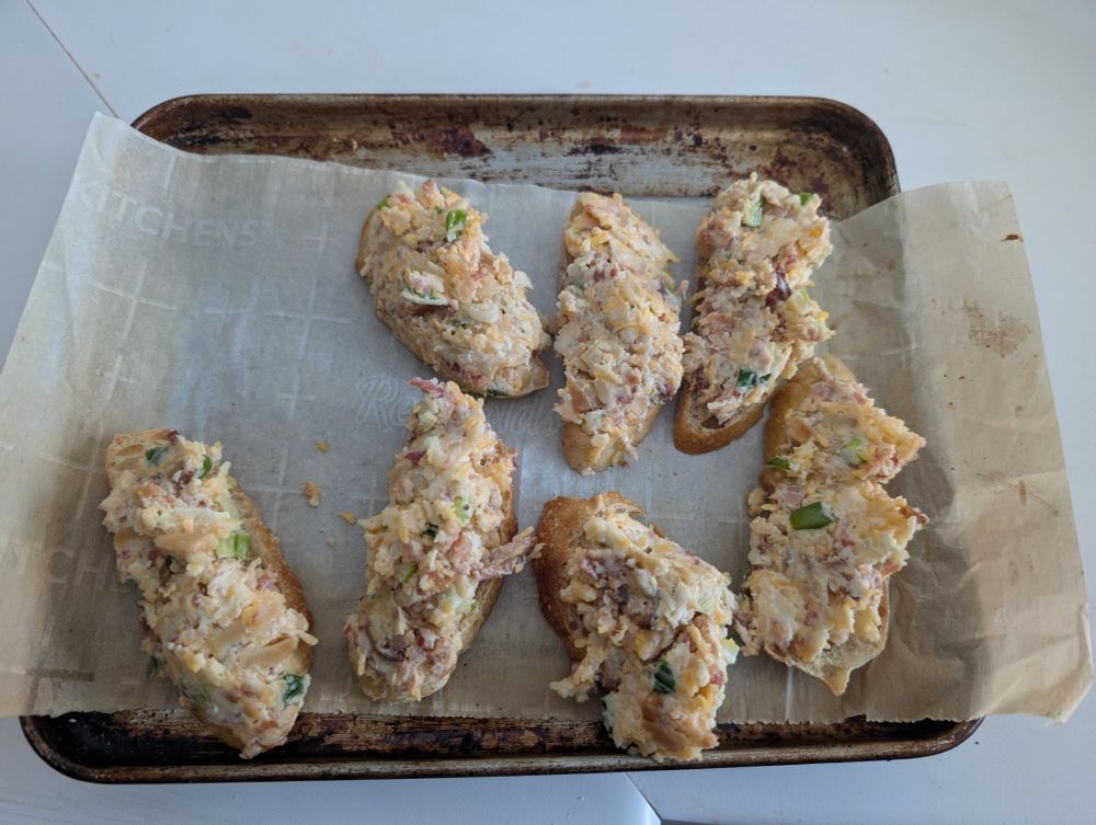 Bacon, almond, cheese, and scallion crostini before.