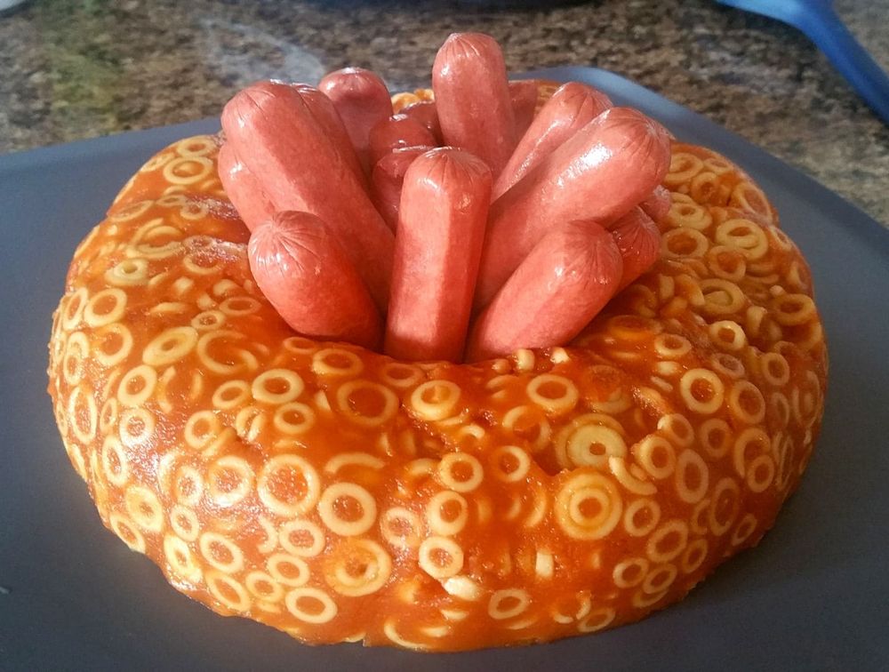 SpaghettiOs in a jello mold with hot dogs stuffed in the center.

It's very unattractive and unappetizing.