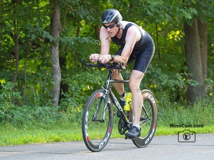 Me looking speedy, down in the aero bars of my black tri bike
