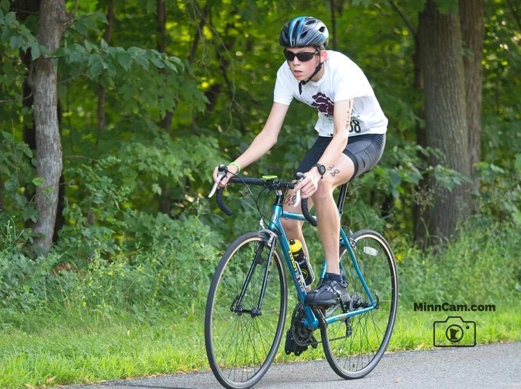 My son pushing hard on his road bike