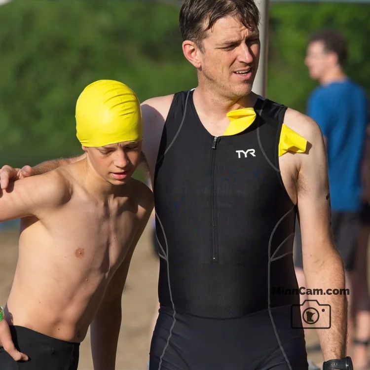 My son and I getting ready for the swim leg of our triathlon