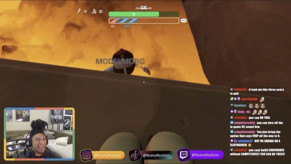 A screenshot of Keanu's twitch stream. He is playing RV There Yet?. Keanu's camera shows him laughing HARD while looking at Morgan in the lava of the game.