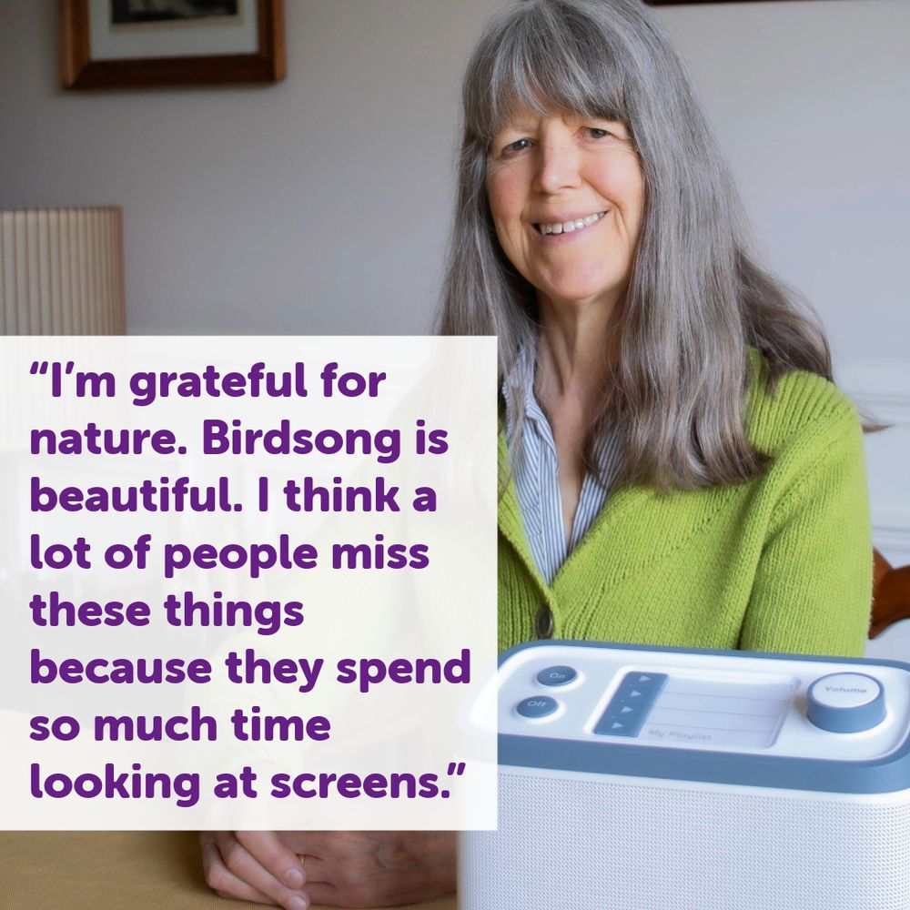 A photo of Janet smiling at a table with her Relish radio from BWBF. Overlaid text reads: "I'm grateful for nature. Birdsong is beautiful. I think a lot of people miss these things because they spend so much time looking at screens."
