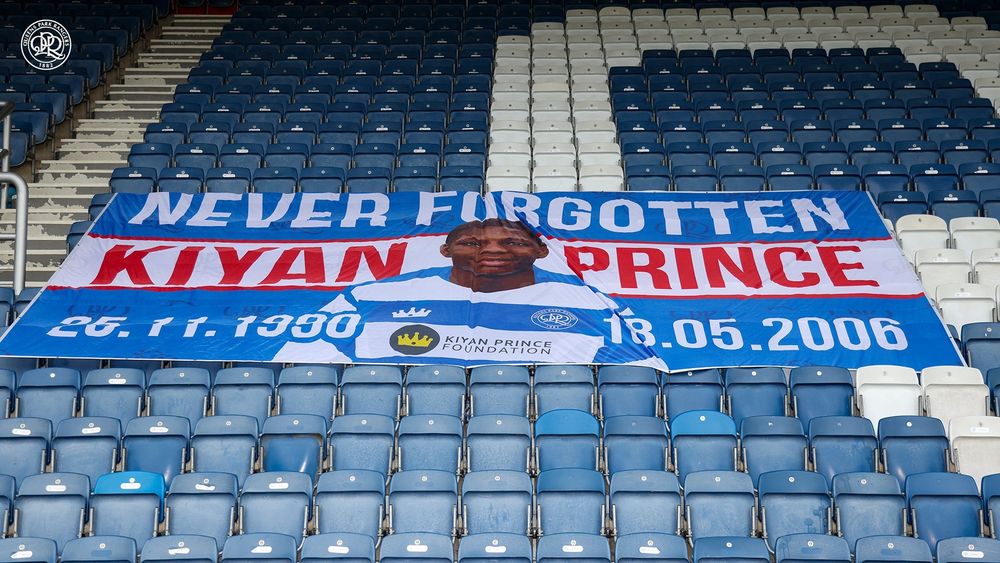 A flag in memory of Kiyan Prince on seats inside MATRADE Loftus Road.
