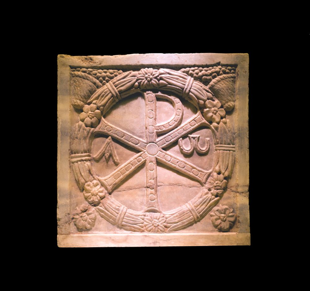 Monogramme of Christ (the Chi Rho) on a plaque of a sarcophagus, 4th-century CE, marble, Musei Vaticani, on display in a temporary exhibition at the Colosseum in Rome, Italy
