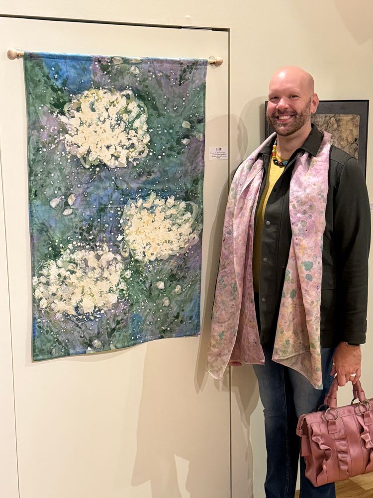 Tonight we attended two Opening Receptions at the Carlisle Arts Learning Center! Upstairs in the “Unraveled” Juried Fibers Exhibit is our original artwork, "Daucus Carota: Queen Anne's Lace," acrylic on canvas [using the Batik process], 48" high by 28" long from July 2025. This exhibition also features several of our hand-painted silk scarves and an array of other artists who employ fibers as a means of creating their art!

Downstairs in "Art for the Holidays" are several of our original artworks; many of which have been discounted for your holiday shopping! Also included are more of our scarves, our cards, ornaments, and an amazing selection of artist work for everyone on your list!

Both exhibitions will remain on-display through Wednesday, December 24, 2025! Plan your trip(s) to Carlisle Arts Learning Center located at 38 West Pomfret Street in Carlisle, PA to see everything we mentioned and so much more!
