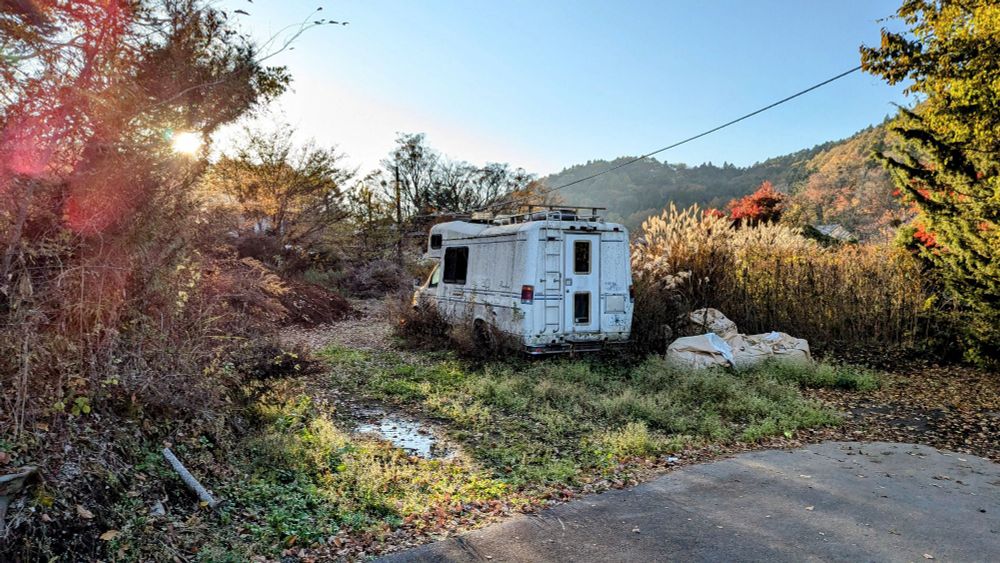 Abandoned trailer in the woods near Oshino Hakkai, Japan. 