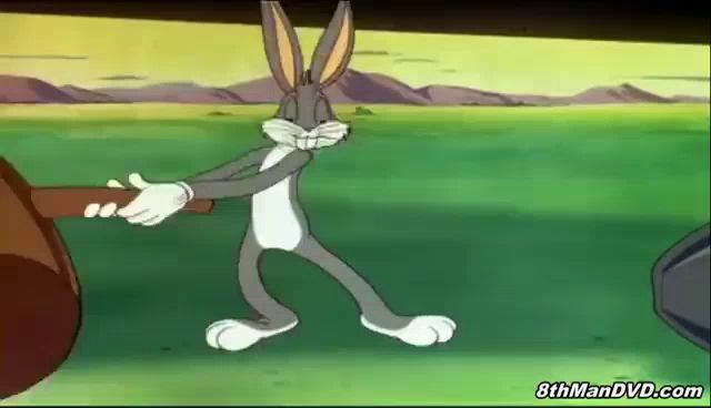 bugs bunny is pulling a large rock in a cartoon